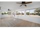 Cozy sun room with natural light from surrounding windows and comfortable seating area at 12831 W Maplewood Dr, Sun City West, AZ 85375