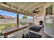 Spacious backyard with a covered patio, perfect for outdoor dining and relaxation, featuring a dining table and a grill at 1320 E Scott Ave, Gilbert, AZ 85234