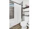 Bathroom features a shower with grey tiling, and storage at 1320 E Scott Ave, Gilbert, AZ 85234