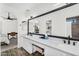 Bathroom featuring a double vanity with a large mirror and modern black fixtures at 1320 E Scott Ave, Gilbert, AZ 85234