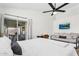 Cozy bedroom showcasing a king-sized bed, futon, and access to a patio at 1320 E Scott Ave, Gilbert, AZ 85234