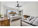 Bright bedroom featuring a king-sized bed, desk and a patio entrance at 1320 E Scott Ave, Gilbert, AZ 85234
