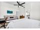 Open bedroom with a bed, futon, tv, and an ensuite bathroom at 1320 E Scott Ave, Gilbert, AZ 85234