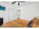 Stylish bedroom includes a TV, complemented by a comfortable bed with decorative pillows and convenient access to the kitchen at 1320 E Scott Ave, Gilbert, AZ 85234