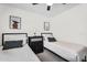 Comfortable bedroom setting featuring twin beds, stylish décor, and a well-organized dresser at 1320 E Scott Ave, Gilbert, AZ 85234