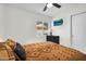 Comfortable bedroom featuring a flat-screen TV, a window with blinds, and a well-made bed at 1320 E Scott Ave, Gilbert, AZ 85234