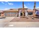 Charming single-story home with a well-manicured front yard, a two-car garage, and mature landscaping at 1320 E Scott Ave, Gilbert, AZ 85234