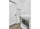 Functional laundry room featuring modern washer, dryer, and an ironing board for added convenience at 1320 E Scott Ave, Gilbert, AZ 85234