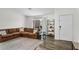 Inviting living room with a cozy sectional sofa, decorative shelving, and a bright, open atmosphere at 1320 E Scott Ave, Gilbert, AZ 85234
