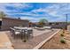 Outdoor living featuring a patio with fire pit and dining, plus stylish seating for relaxation at 1322 W Flower St, Phoenix, AZ 85013