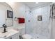 Modern bathroom with marble tile shower, toilet and vanity at 1322 W Flower St, Phoenix, AZ 85013