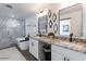 Modern bathroom with double vanity, freestanding tub, and glass enclosed shower at 1322 W Flower St, Phoenix, AZ 85013