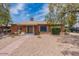 Charming single-story brick home with well kept yard and covered parking at 1322 W Flower St, Phoenix, AZ 85013