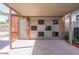 Spacious carport with exterior door, adjacent to a brick building at 1322 W Flower St, Phoenix, AZ 85013