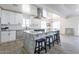 Kitchen with granite countertops, stainless steel appliances, and a central island and bar stool seating at 1322 W Flower St, Phoenix, AZ 85013