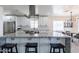 Kitchen with granite countertops, stainless steel appliances, and a central island, connecting to the dining area at 1322 W Flower St, Phoenix, AZ 85013