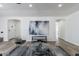 Bright living room with modern decor, art piece and a modern wire-frame chair at 1322 W Flower St, Phoenix, AZ 85013