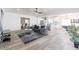 Open concept living room flowing into a kitchen and dining area featuring modern decor at 1322 W Flower St, Phoenix, AZ 85013