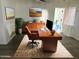 Bright office space featuring a wooden desk and comfortable seating, ideal for productivity at 1322 W Flower St, Phoenix, AZ 85013