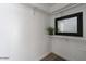 Functional walk-in closet with ample shelving, a mirror, and modern lighting at 1322 W Flower St, Phoenix, AZ 85013