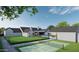 Expansive backyard featuring a pool, tennis court, lush landscaping, and a modern home design at 13402 N 79Th St, Scottsdale, AZ 85260