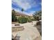 Spacious backyard with a built-in barbecue area and a charming stone fire pit at 14380 W Monte Vista Rd, Goodyear, AZ 85395