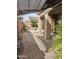 Relaxing backyard featuring a covered patio and a cozy stone fire pit at 14380 W Monte Vista Rd, Goodyear, AZ 85395