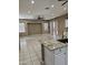 Bright and spacious kitchen area with granite countertops and a large island that provides ample cooking and dining space at 14380 W Monte Vista Rd, Goodyear, AZ 85395
