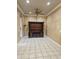 Spacious living room featuring a built-in entertainment center and neutral tones throughout at 14380 W Monte Vista Rd, Goodyear, AZ 85395