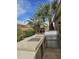 Outdoor kitchen area with a built-in grill, counter space, and lush landscaping for entertaining at 14380 W Monte Vista Rd, Goodyear, AZ 85395