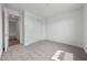 Bright bedroom featuring neutral carpet, closet, and interior door at 14789 W Lariat Ln, Surprise, AZ 85387