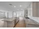 Open-concept kitchen with large island, stainless appliances, and spacious pantry at 14789 W Lariat Ln, Surprise, AZ 85387