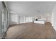 Spacious living area with wood-look tile flowing into an open concept kitchen at 14789 W Lariat Ln, Surprise, AZ 85387