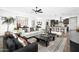 Open-concept living room features stylish furnishings and seamless flow into the kitchen at 14789 W Lariat Ln, Surprise, AZ 85387