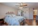 Primary bedroom with wood-look floors and a walk-in closet at 1520 N Milly Pl, Casa Grande, AZ 85122