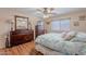 Spacious bedroom boasts a window, wood-look floors and ample natural light at 1520 N Milly Pl, Casa Grande, AZ 85122