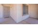 Close-up of the front porch with a secure door, an accent window and desert-style accents at 1520 N Milly Pl, Casa Grande, AZ 85122