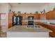 Kitchen with an island, modern appliances, and plentiful cabinet space at 1520 N Milly Pl, Casa Grande, AZ 85122