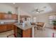 A kitchen with a breakfast nook with views to the living room at 1520 N Milly Pl, Casa Grande, AZ 85122