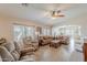 Open-concept living room with tile flooring, neutral tones, and lots of seating at 1520 N Milly Pl, Casa Grande, AZ 85122