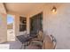 Cozy covered patio area with table and seating, perfect for relaxing outdoors at 1520 N Milly Pl, Casa Grande, AZ 85122