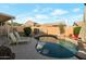 Enjoy the outdoors in this private backyard with a unique rock-feature pool and ample patio space at 15421 S 16Th Dr, Phoenix, AZ 85045