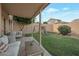 Backyard features a covered patio and grassy area with a swing set at 15421 S 16Th Dr, Phoenix, AZ 85045