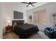 Cozy bedroom featuring neutral colors, carpet flooring, and ample natural light at 15421 S 16Th Dr, Phoenix, AZ 85045