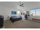 Large primary bedroom featuring carpet flooring and plenty of natural light at 15421 S 16Th Dr, Phoenix, AZ 85045