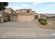 Charming two-story home featuring a three-car garage and low maintenance desert landscaping in a residential neighborhood at 15421 S 16Th Dr, Phoenix, AZ 85045