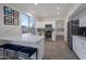 Modern kitchen with stainless steel appliances, large window and eat-in dining area at 15421 S 16Th Dr, Phoenix, AZ 85045