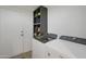 Functional laundry room with modern appliances and storage shelving at 15421 S 16Th Dr, Phoenix, AZ 85045