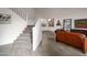 Bright living room featuring high ceilings, staircase, hardwood flooring and large windows offering plenty of natural light at 15421 S 16Th Dr, Phoenix, AZ 85045