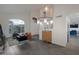Bright living room featuring high ceilings, staircase, hardwood flooring and large windows offering plenty of natural light at 15421 S 16Th Dr, Phoenix, AZ 85045